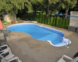 Swimming pool surrounded with patio area