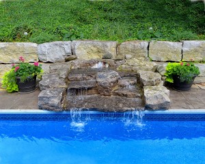Inground pool with water cascade