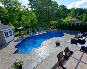 Inground pool with large patio area