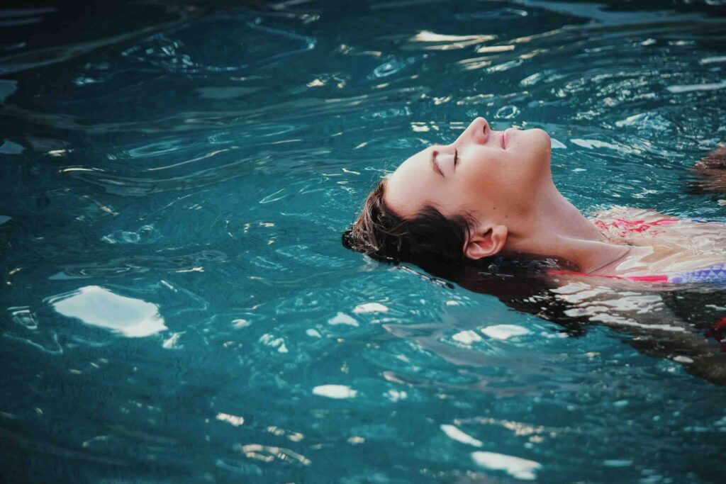 Woman relaxing in a plunge pool