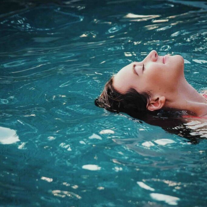 Woman relaxing in a plunge pool